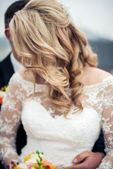 close up of bridal wedding white dress . cloth and beads