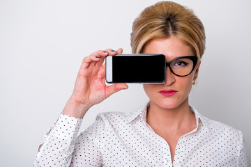 Young business woman shows on your phone