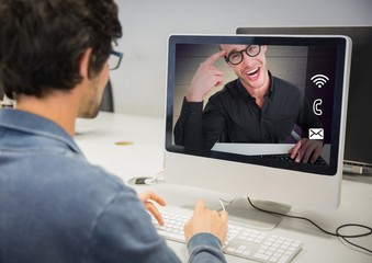 Fototapeta na wymiar Man having a video call with his friend on desktop pc