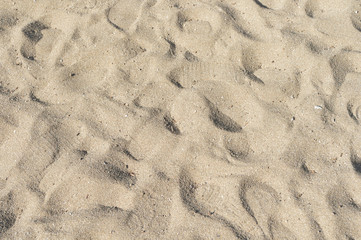 Sand background with footprints 