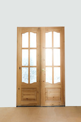 wooden double-leaf door on a light background