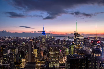Fotobehang Aerial view of Manhattan Skyline at sunset - New York, USA © diegograndi