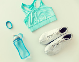 close up of sportswear, bracelet and bottle