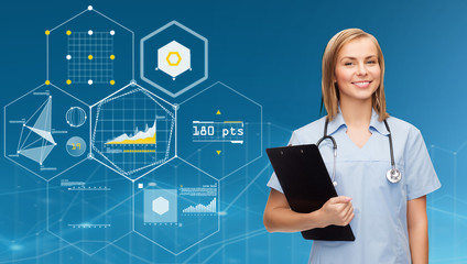 smiling female doctor or nurse with clipboard