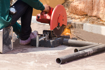 A man skilled working factory welder,cutting,grinding,drill