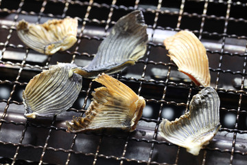 grilling dried blowfish fins for Hirezake (japanese hot sake drink ). © uckyo