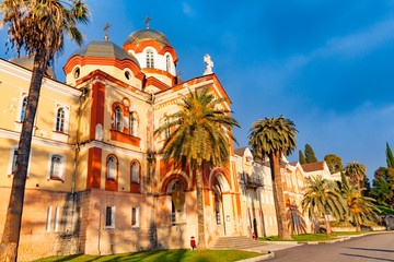 Fototapeta na wymiar New Athos monastery of St. Simon the Canaanite monastery in the sunshine. New Athos, Abkhazia.