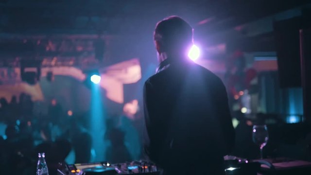 DJ Turns The Records at The Modern Nightclub, Back View, Slow Motion
