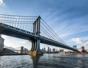 Fototapeta na wymiar Manhattan Bridge with Brooklyn Bridge and Manhattan Skyline as background - New York, USA