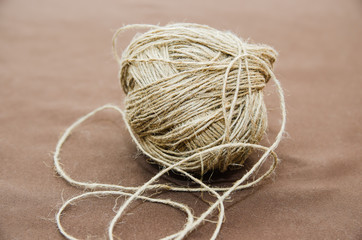 Skein of twine, rope on a beige background. Flat Lay