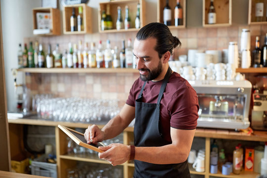 Happy Man Or Waiter With Chalkboard Banner At Bar