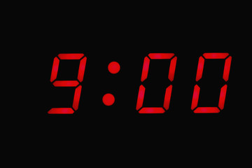 Digital clock displaying nine o'clock