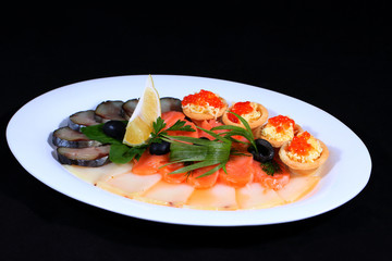 Beautifully decorated Appetizer. Dark background.