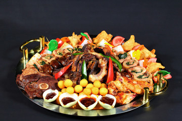 Beautifully decorated Appetizer. Dark background.