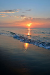 Fototapeta premium Serene Summer Sunrise Along the Shore