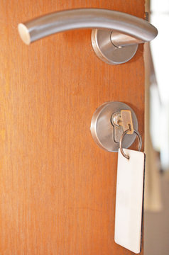 usual hotel door open with door lock and door handle