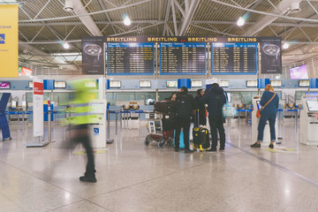 Passengers in Athens International Airport. Blur motion.