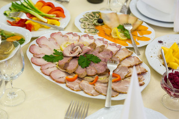 Meat cutting the wedding table. Fat meat slices texture.
