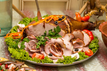 Pork leg sliced on a plate. Baked sliced meat. Roasted meat sliced