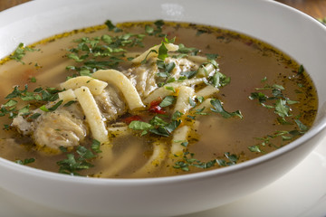 Chicken soup with noodles and herbs