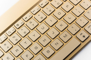 Gold keyboard on a white background