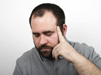 Fototapeta premium Young man with beard with serious gesture. Isolated.