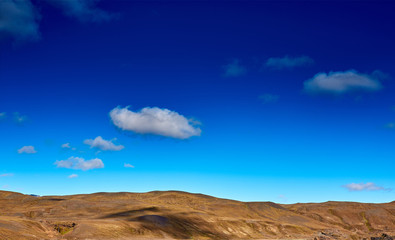 Travel to Iceland. Beautiful Icelandic landscape with mountains, sky and clouds. Trekking in national park Landmannalaugar