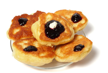 fritters with jam with tea on wood