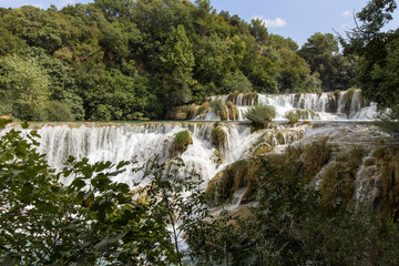 Waterfalls and cascades at the Krka National Park in Croatia, on a sunny day.