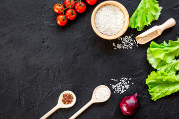 ingredients for paella on dark background top view