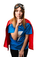 Pretty superhero girl making silence gesture © luismolinero
