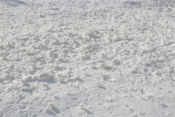 Snow surface close up macro, winter background, shallow depth of field