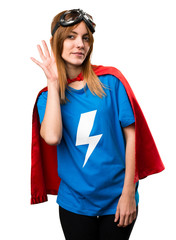 Pretty superhero girl listening something