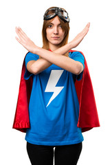 Pretty superhero girl making NO gesture