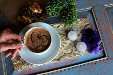 morning cappuccino with hearts, with cookies and flowers