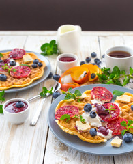 Coffee and Belgium waffles with blueberry. Breakfast concept.