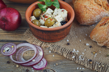 Fototapeta premium Ingredients for vegetables salad on a wooden background.