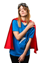 Pretty superhero girl with shoulder pain