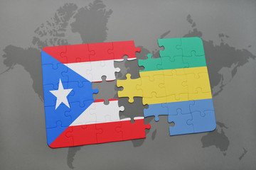 puzzle with the national flag of puerto rico and gabon on a world map