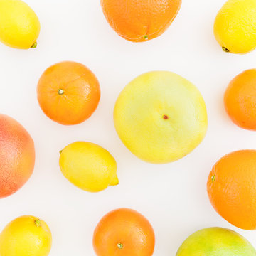 Citrus fruits - lemon, orange, grapefruit, sweetie and pomelo isolated on white background. Flat lay, top view. Summer background