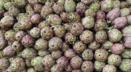 background of artichokes for sale in Italian market