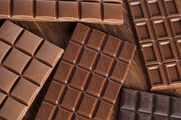 Bars Chocolate , candy sweet, dessert food on wooden background