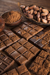 Dark and milk chocolate bar on a wooden table