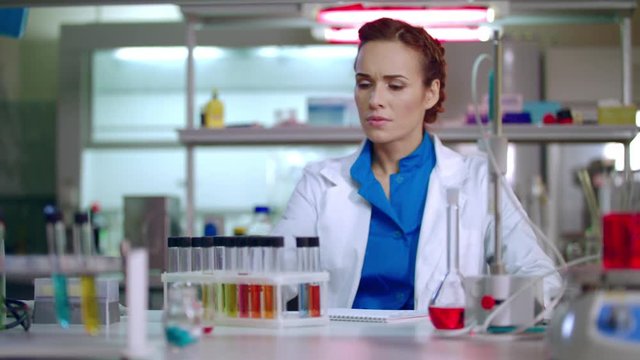 Female chemist preparing for chemical research. Woman chemist in lab. Chemistry woman wearing glasses. Chemical lab research process. Female lab chemist in chemical laboratory