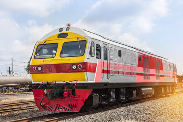 Fototapeta premium yellow diesel engine locomotive train on station