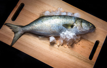 raw fish on the wooden board