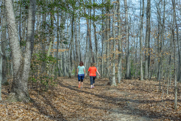 Two Women Walking Down a Trail, Exercising