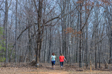 Two Women Walking Down a Trail, Exercising