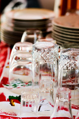 Washed glasses turned upside down and other various dishes