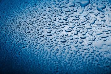 Wet metal background,in blue tone.